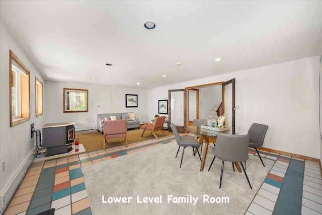 5217 E Stoughton Rd, Valleyford, WA 99036 - dining area featuring a wood stove, recessed lighting, baseboards, and a baseboard heating unit
