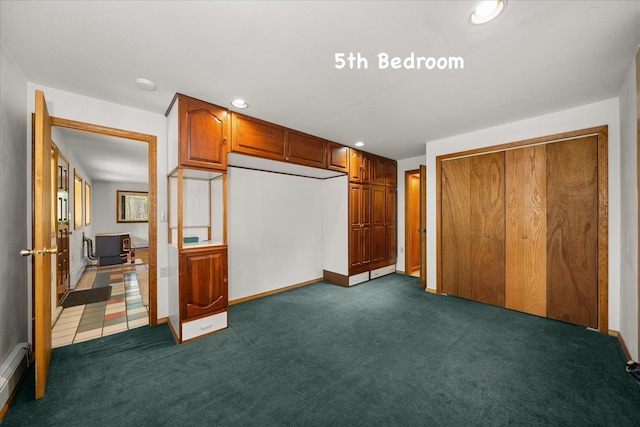 5217 E Stoughton Rd, Valleyford, WA 99036 - unfurnished bedroom featuring dark carpet, recessed lighting, baseboards, and a baseboard radiator