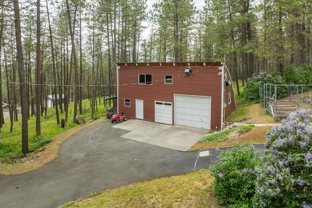 5217 E Stoughton Rd, Valleyford, WA 99036 - view of property exterior featuring driveway and a garage