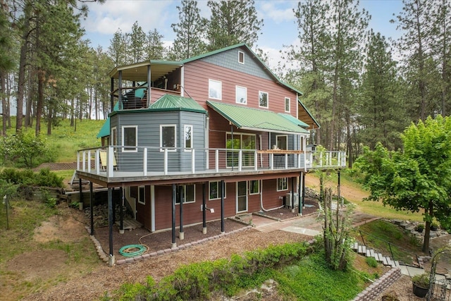 5217 E Stoughton Rd, Valleyford, WA 99036 - rear view of house with a deck and metal roof