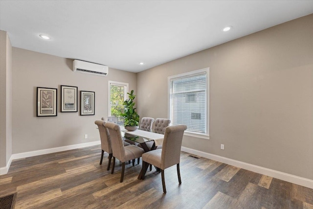 1721 E 12th Ave, Spokane, WA 99202 - dining area with a wall unit AC, dark wood-style flooring, baseboards, and recessed lighting