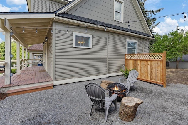1721 E 12th Ave, Spokane, WA 99202 - rear view of house featuring roof with shingles, an outdoor fire pit, and a patio area