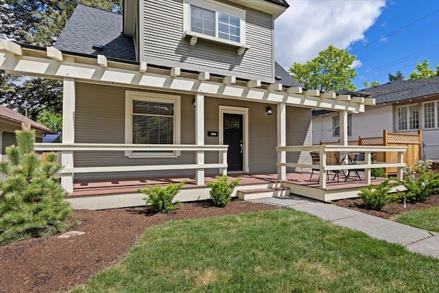 1721 E 12th Ave, Spokane, WA 99202 - view of front facade featuring a porch, roof with shingles, and a front lawn
