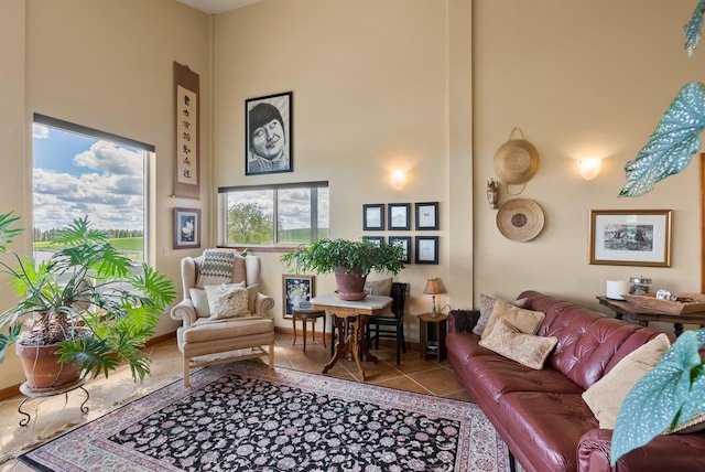 8310 E Belair Rd, Valleyford, WA 99036 - tiled living room with a towering ceiling and baseboards