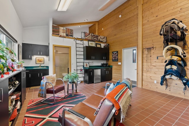8310 E Belair Rd, Valleyford, WA 99036 - living room featuring wood walls and light tile patterned floors