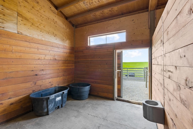 8310 E Belair Rd, Valleyford, WA 99036 - misc room with wood ceiling, wood walls, and unfinished concrete floors