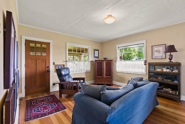 8310 E Belair Rd, Valleyford, WA 99036 - living room with wood finished floors, crown molding, and baseboards