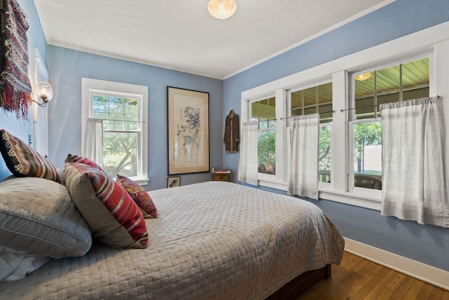 8310 E Belair Rd, Valleyford, WA 99036 - bedroom featuring wood finished floors, access to outside, baseboards, and ornamental molding