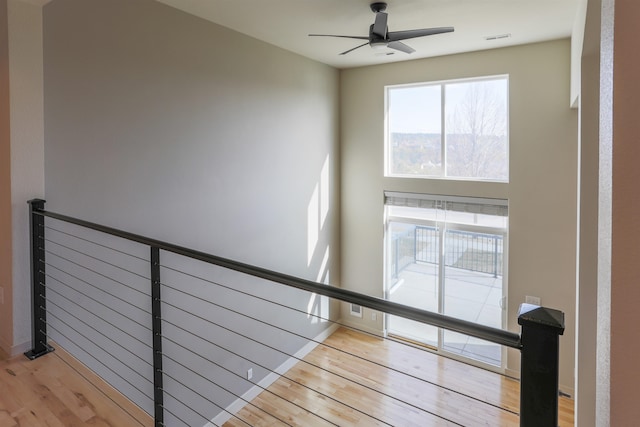 1810 W Summit Pkwy, Spokane, WA 99201 - stairway featuring wood finished floors, a ceiling fan, and baseboards