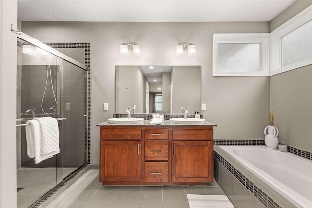 7708 N Warren Ln, Spokane, WA 99208 - full bath with double vanity, tile patterned floors, a bath, and a shower stall