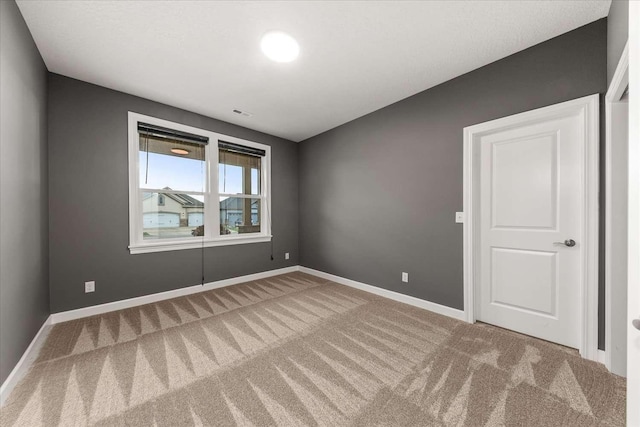 7708 N Warren Ln, Spokane, WA 99208 - unfurnished room featuring carpet flooring and baseboards