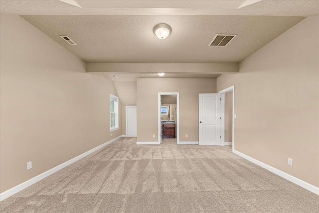 7708 N Warren Ln, Spokane, WA 99208 - spare room featuring light carpet, a textured ceiling, and baseboards