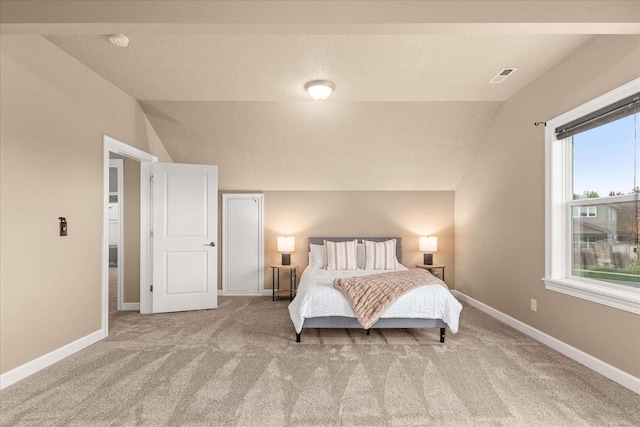7708 N Warren Ln, Spokane, WA 99208 - carpeted bedroom with lofted ceiling, multiple windows, and baseboards
