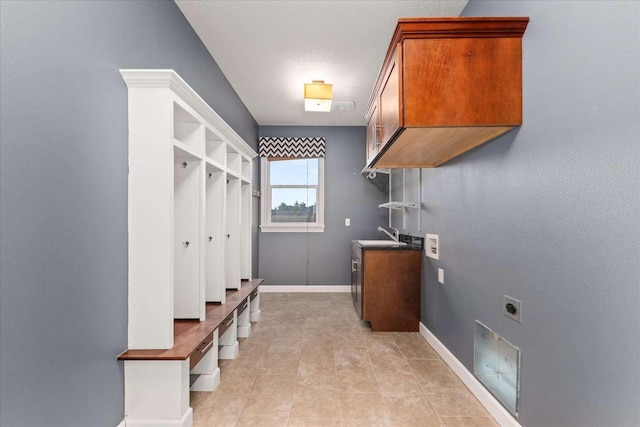7708 N Warren Ln, Spokane, WA 99208 - mudroom with baseboards and a sink