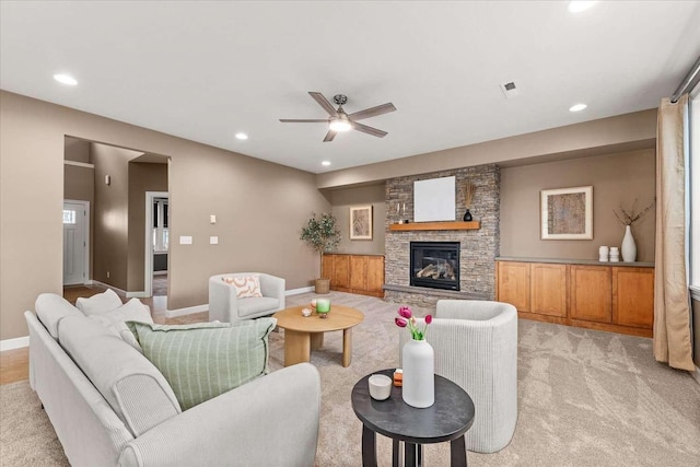 7708 N Warren Ln, Spokane, WA 99208 - living room featuring recessed lighting, ceiling fan, a stone fireplace, light carpet, and baseboards