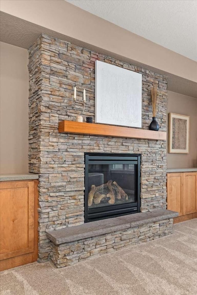 7708 N Warren Ln, Spokane, WA 99208 - detailed view of carpet flooring, a fireplace, and a textured ceiling