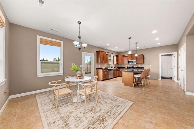 7708 N Warren Ln, Spokane, WA 99208 - dining room with baseboards, a chandelier, and recessed lighting