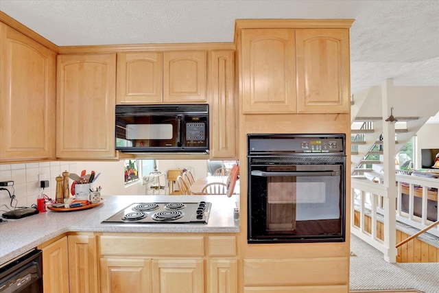 13227 N E Newman Lake Dr, Newman Lake, WA 99025 - kitchen with light brown cabinets, black appliances, a textured ceiling, light countertops, and decorative backsplash