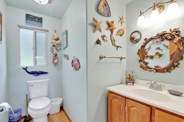 13227 N E Newman Lake Dr, Newman Lake, WA 99025 - bathroom featuring toilet, vanity, and wood finished floors