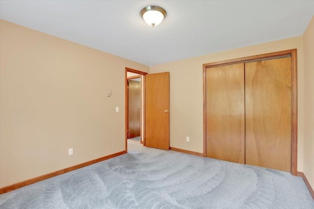 13227 N E Newman Lake Dr, Newman Lake, WA 99025 - bedroom featuring baseboards, light colored carpet, and a closet