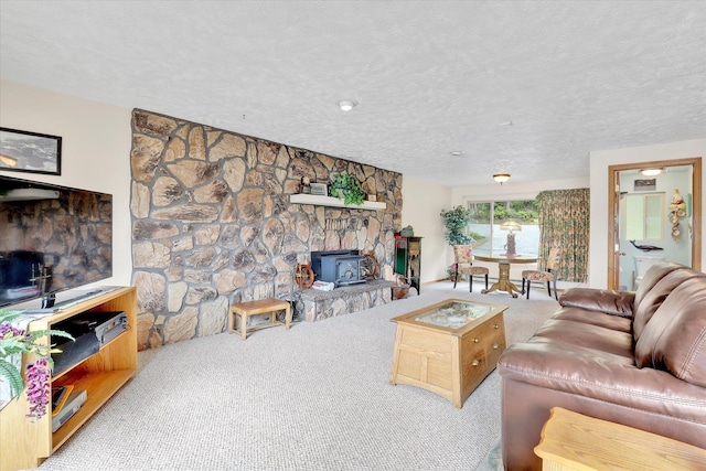 13227 N E Newman Lake Dr, Newman Lake, WA 99025 - carpeted living area featuring a wood stove and a textured ceiling