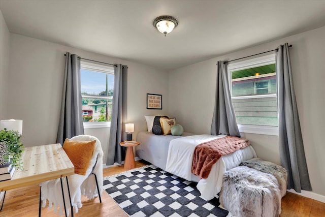 bedroom with wood finished floors