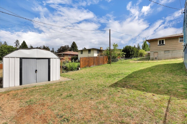 view of yard featuring a shed and an outdoor structure