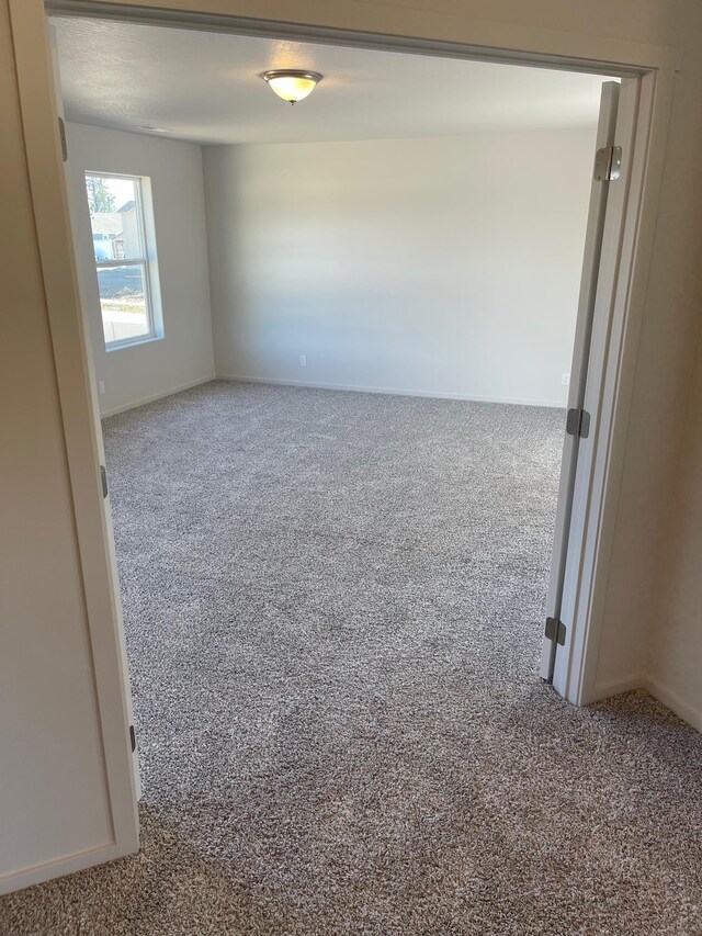 18718 E Riverside Ct, Spokane Valley, WA 99016 - spare room with carpet and baseboards