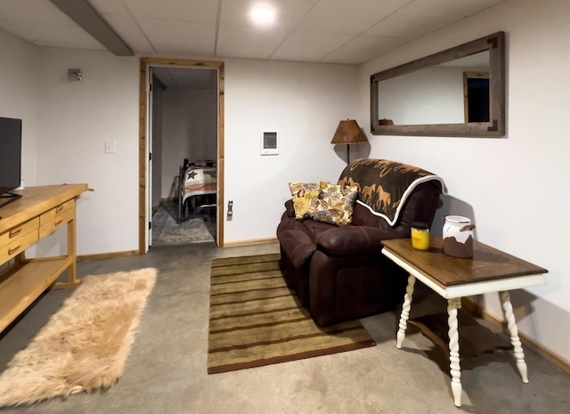 carpeted living room with baseboards