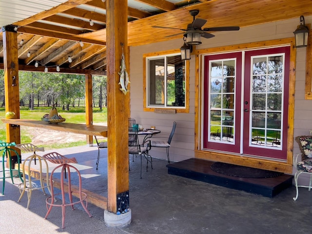 view of patio / terrace featuring a ceiling fan and french doors
