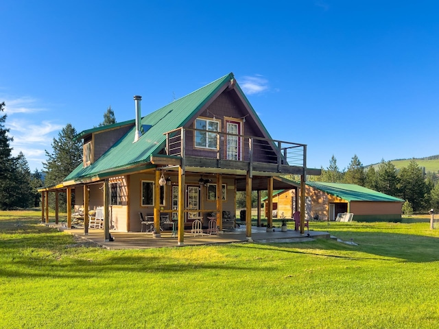 20 River Ranch Rd, Kettle Falls, WA 99141 - back of house featuring a patio, a yard, and metal roof