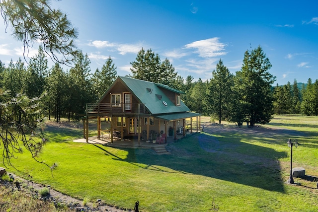 20 River Ranch Rd, Kettle Falls, WA 99141 - rear view of property with a lawn, a deck, a patio, and metal roof