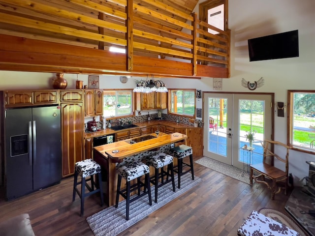 kitchen with stainless steel fridge, french doors, dark wood-style floors, and black electric cooktop