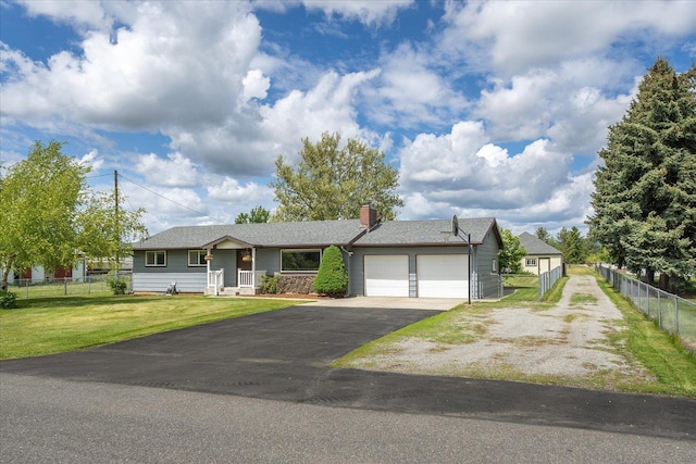 24005 E Garland Ave, Otis Orchards, WA 99027 - single story home featuring an attached garage, driveway, and a chimney