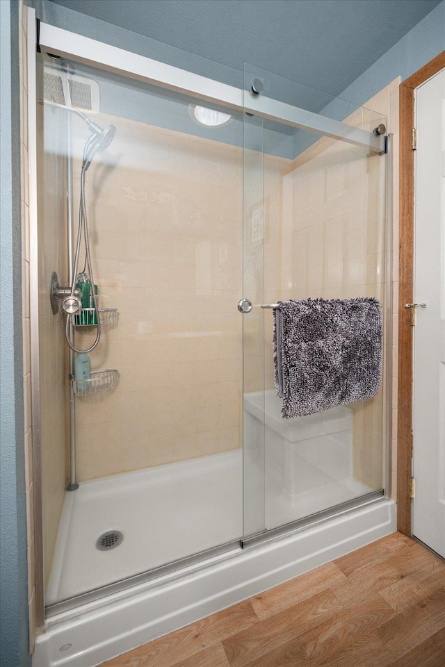 24005 E Garland Ave, Otis Orchards, WA 99027 - full bath featuring a stall shower and wood finished floors