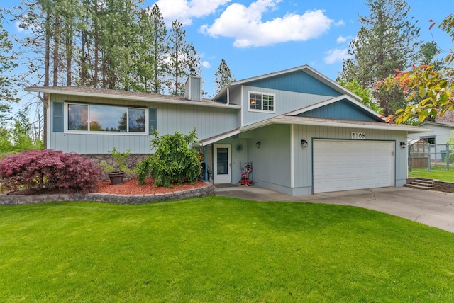 4109 S Hollow Ct, Spokane, WA 99206 - tri-level home with an attached garage, driveway, a chimney, and roof with shingles