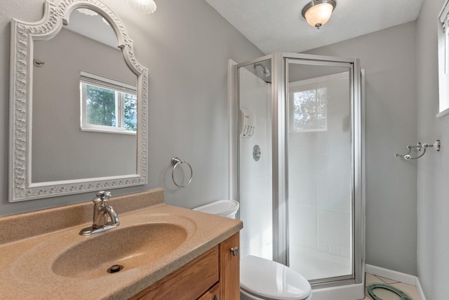 4109 S Hollow Ct, Spokane, WA 99206 - bathroom with toilet, a stall shower, and vanity