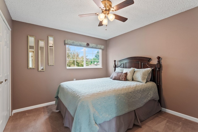 4109 S Hollow Ct, Spokane, WA 99206 - bedroom with carpet, a closet, baseboards, ceiling fan, and a textured ceiling