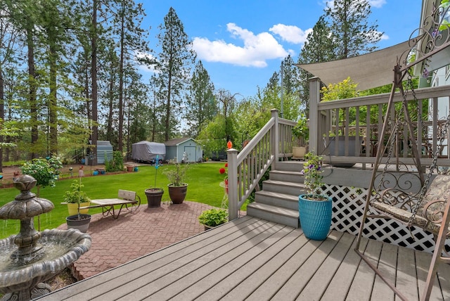 4109 S Hollow Ct, Spokane, WA 99206 - deck featuring a lawn, a patio, a storage shed, and an outdoor structure