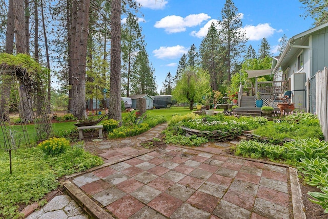 4109 S Hollow Ct, Spokane, WA 99206 - view of yard with a patio, a wooden deck, an outbuilding, and stairway