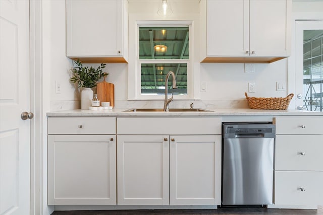3424 W Princeton Ave, Spokane, WA 99205 - kitchen with stainless steel dishwasher, a sink, white cabinets, and light stone countertops