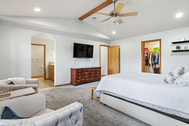 6482 Lakeview Dr, Nine Mile Falls, WA 99026 - bedroom with arched walkways, recessed lighting, a walk in closet, light carpet, and ensuite bath