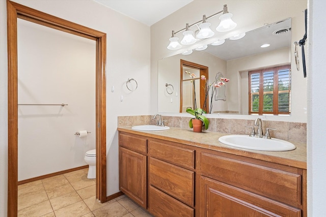 6482 Lakeview Dr, Nine Mile Falls, WA 99026 - full bathroom with toilet, tile patterned floors, double vanity, a shower with shower door, and baseboards