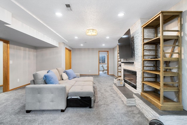 6482 Lakeview Dr, Nine Mile Falls, WA 99026 - carpeted living room with baseboards, recessed lighting, a textured ceiling, and a fireplace
