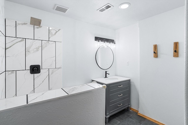 6482 Lakeview Dr, Nine Mile Falls, WA 99026 - full bathroom featuring a tile shower, vanity, and baseboards