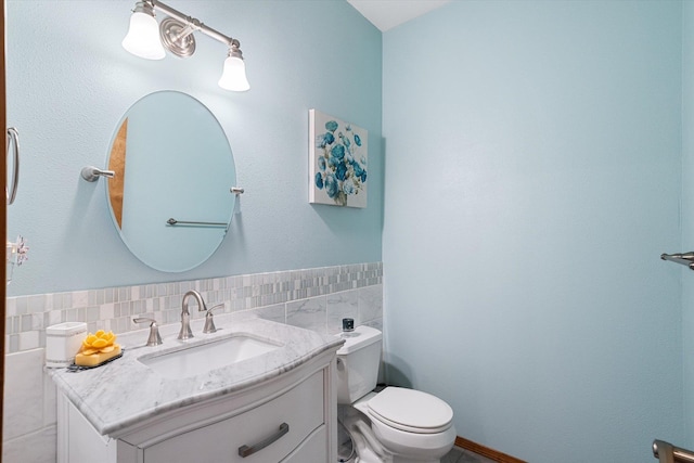 6482 Lakeview Dr, Nine Mile Falls, WA 99026 - bathroom featuring vanity, toilet, and tile walls