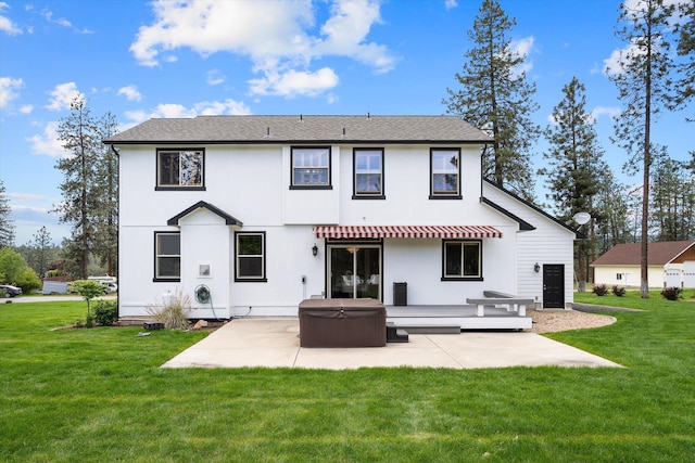 6482 Lakeview Dr, Nine Mile Falls, WA 99026 - rear view of property featuring a hot tub, a patio, and a lawn