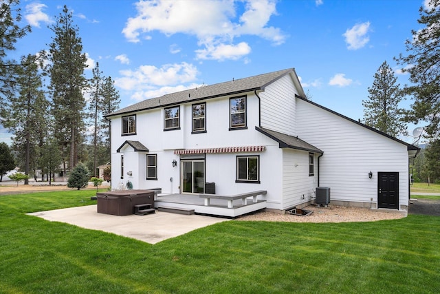 6482 Lakeview Dr, Nine Mile Falls, WA 99026 - back of house featuring a hot tub, cooling unit, a lawn, a patio, and a wooden deck