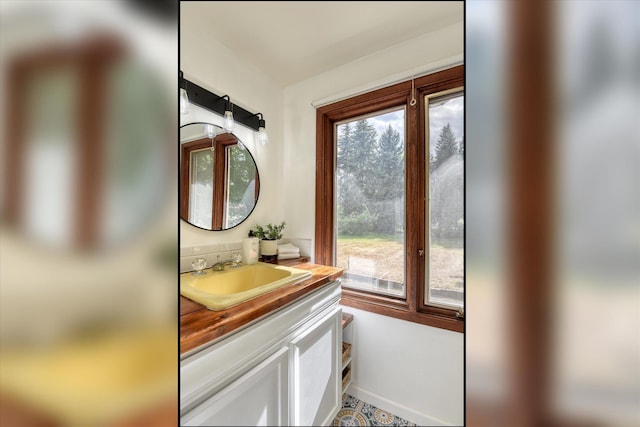 bathroom with plenty of natural light and vanity