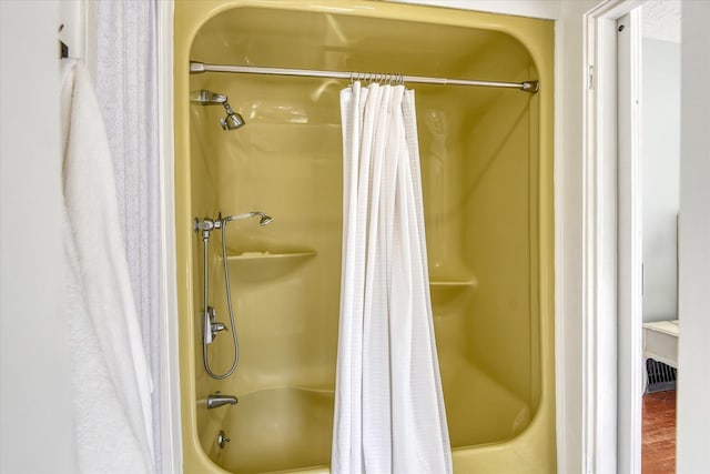 bathroom with shower / bathtub combination with curtain